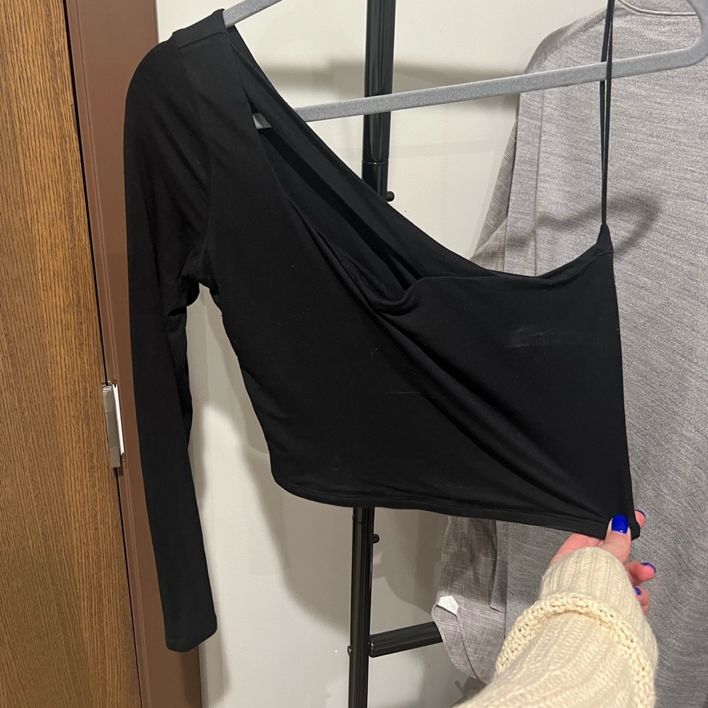 One shoulder black top.